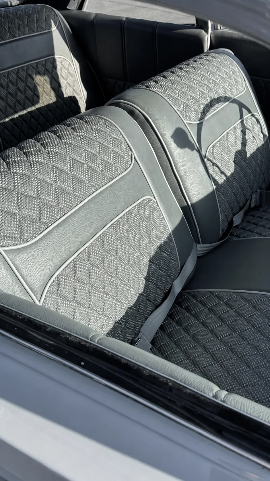 Finished classic interior with diamond-stitched benches