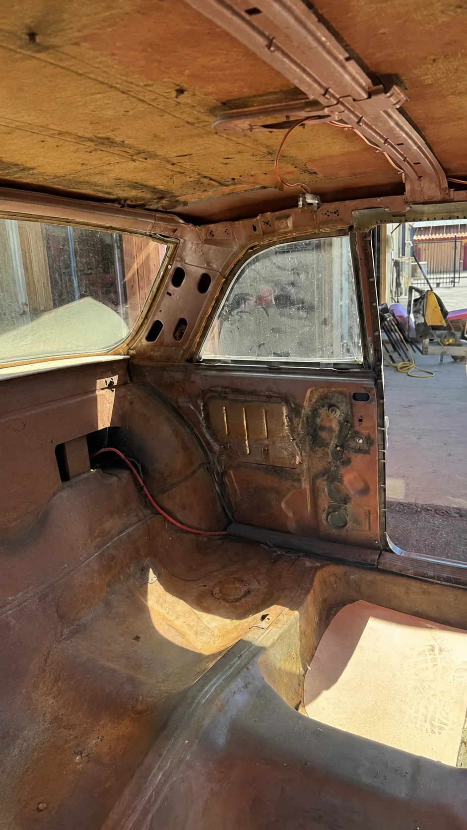 Classic car interior stripped to bare metal